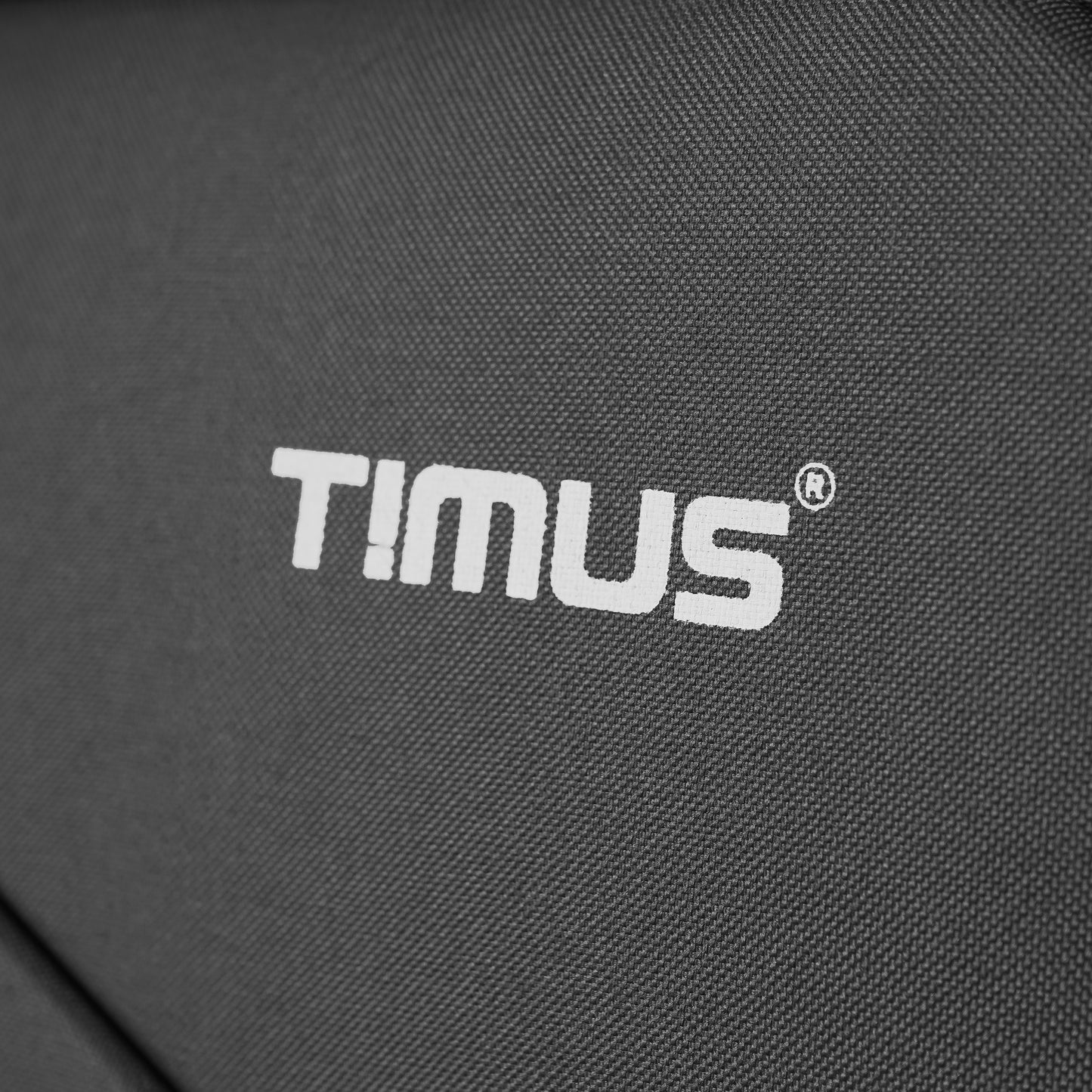Timus logo printed on front of grey Flash Plus soft luggage