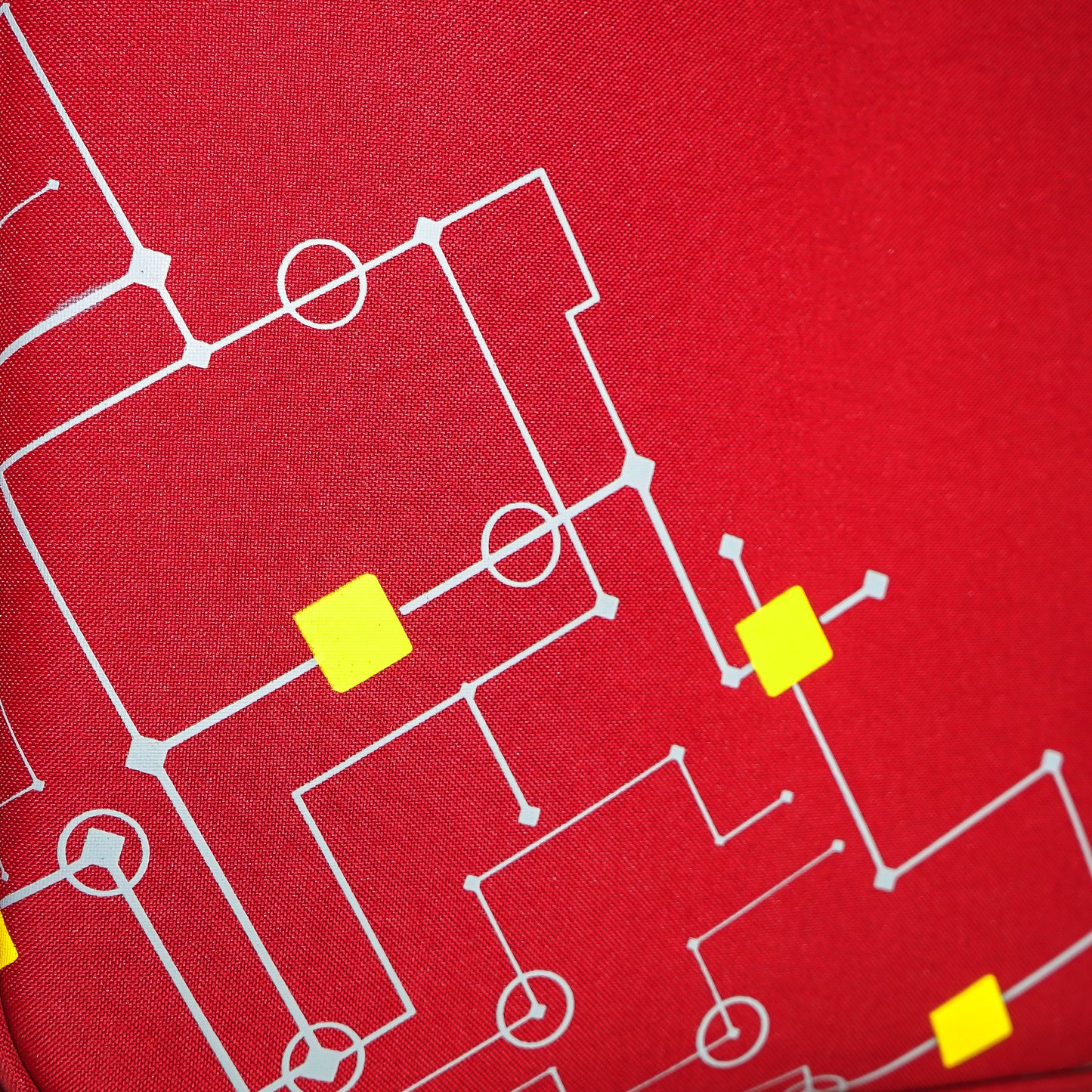 Close-up of printed design on red Flash Plus soft luggage
