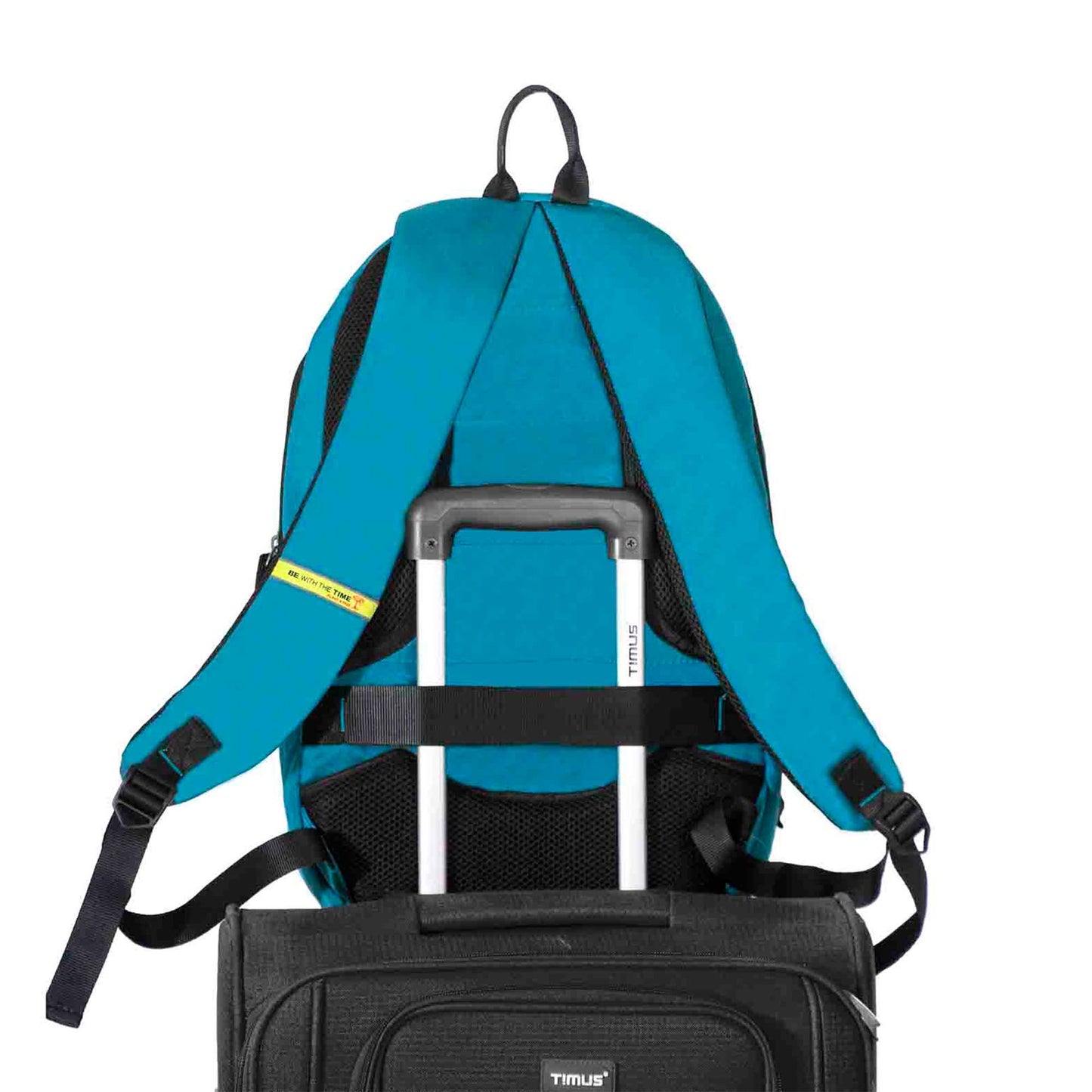 Back view of blue 'Here I Am' backpack securely attached to a trolley luggage handle using the built-in luggage strap, showcasing padded shoulder straps, breathable back panel, and a travel-friendly design.