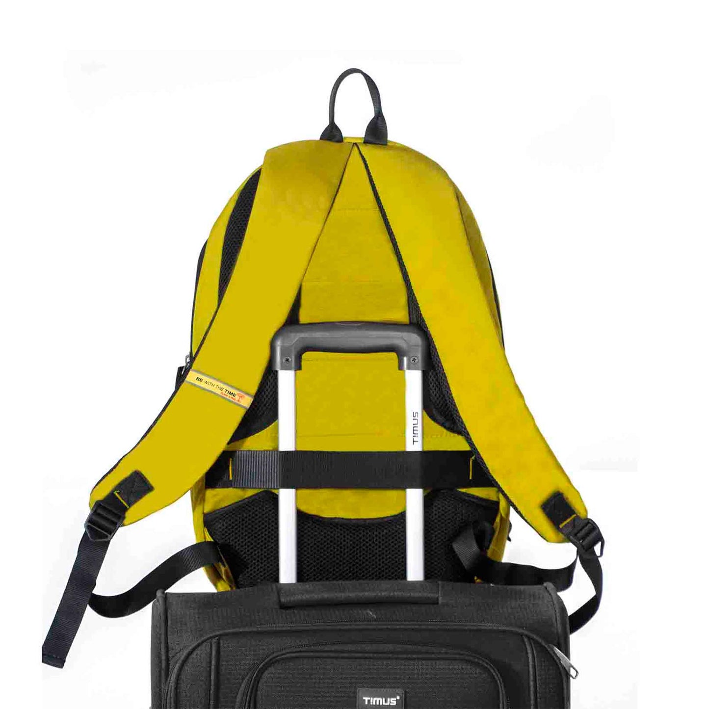 Back view of yellow Here I Am backpack secured on trolley luggage handle using built-in luggage strap, showing padded shoulder straps and travel-friendly design.