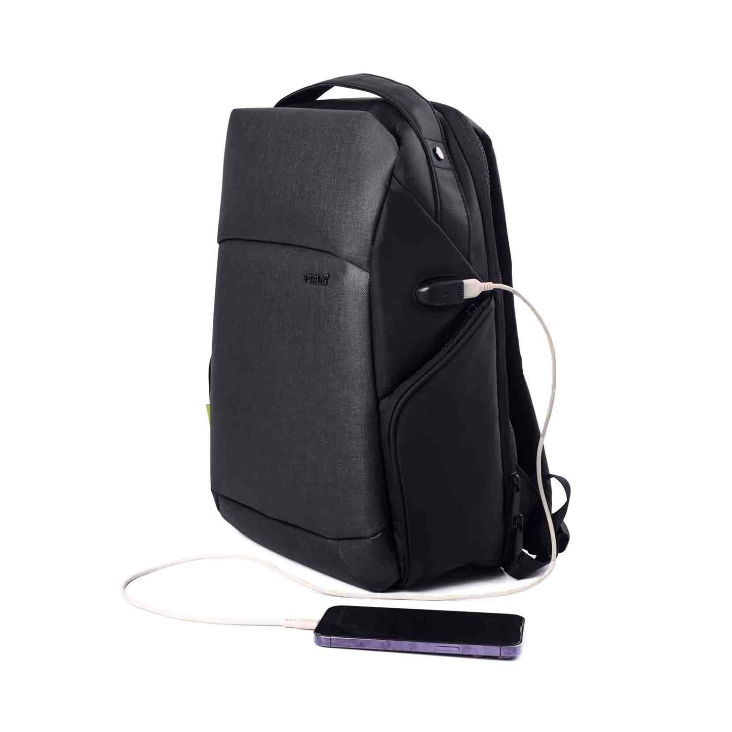 Left front angled view of the black Madrid Laptop Backpack by Timus, featuring a sleek design with a visible USB charging port and a connected smartphone.
