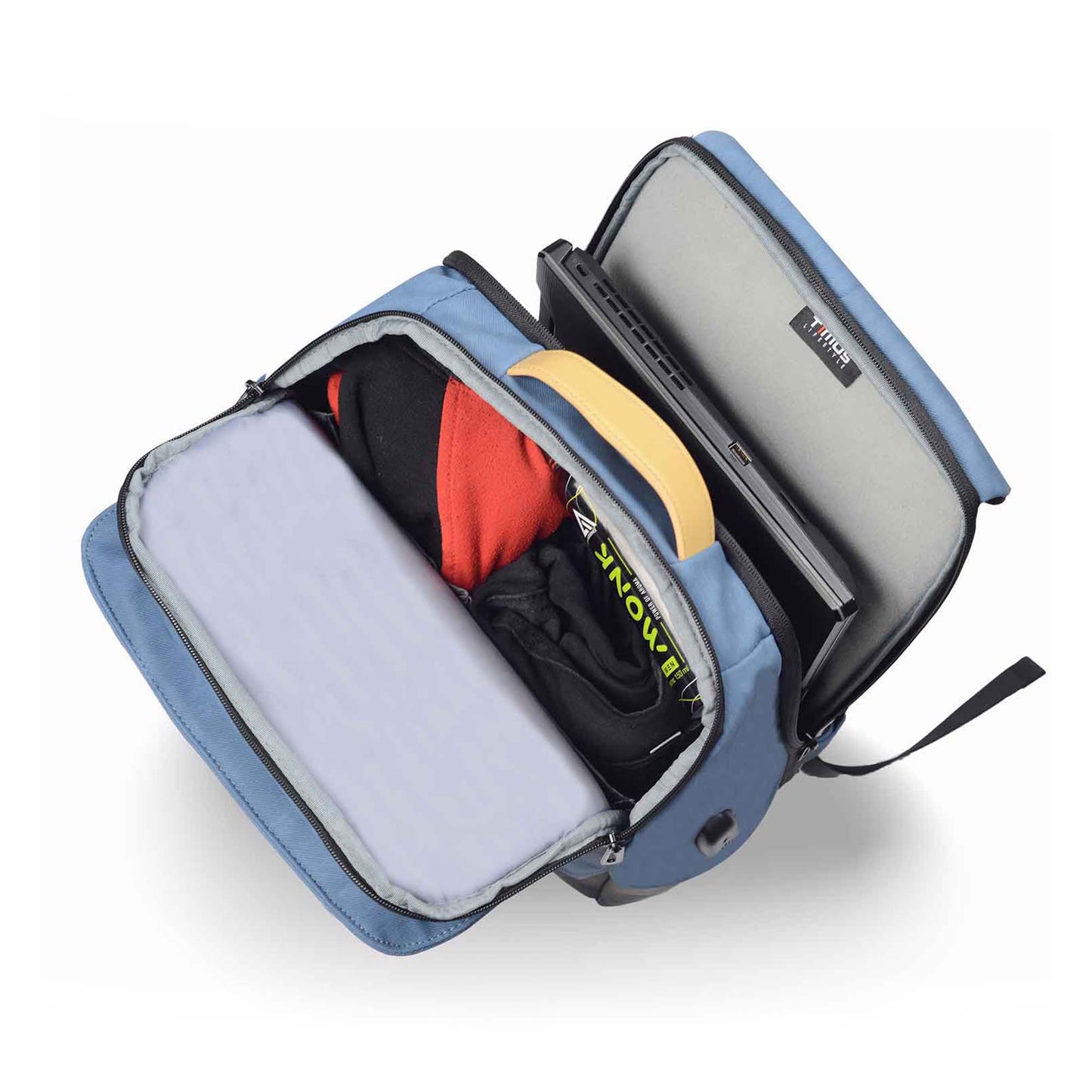 Top open view of the Timus Magnet Overnighter backpack in blue, showing organized compartments with clothes, a laptop sleeve, tan handle, and internal branding.
