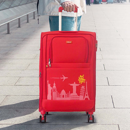 Red suitcase with travel-themed design on a pavement