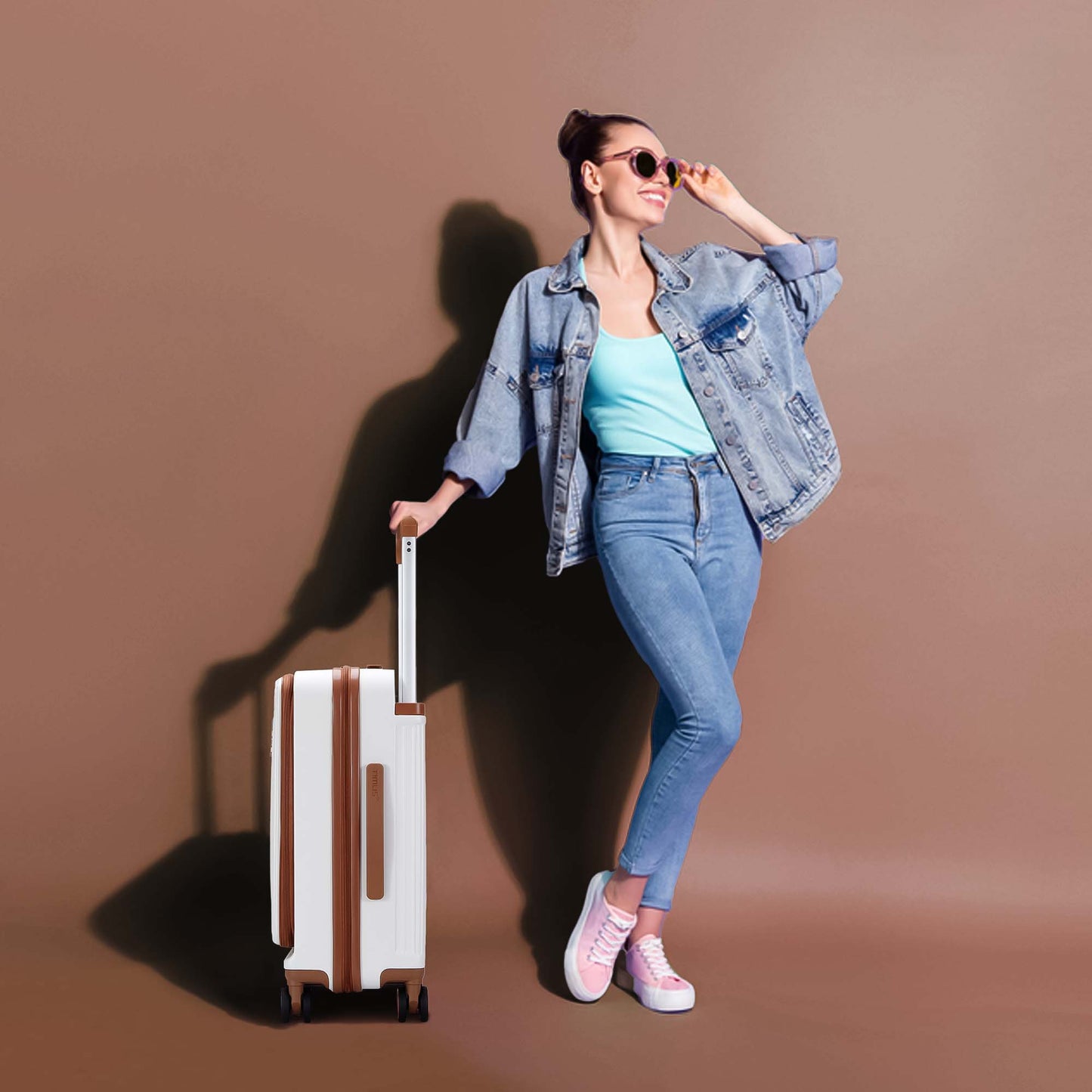Model standing confidently with Timus Starlite ivory hard luggage showcasing modern, elegant, and travel-ready design.