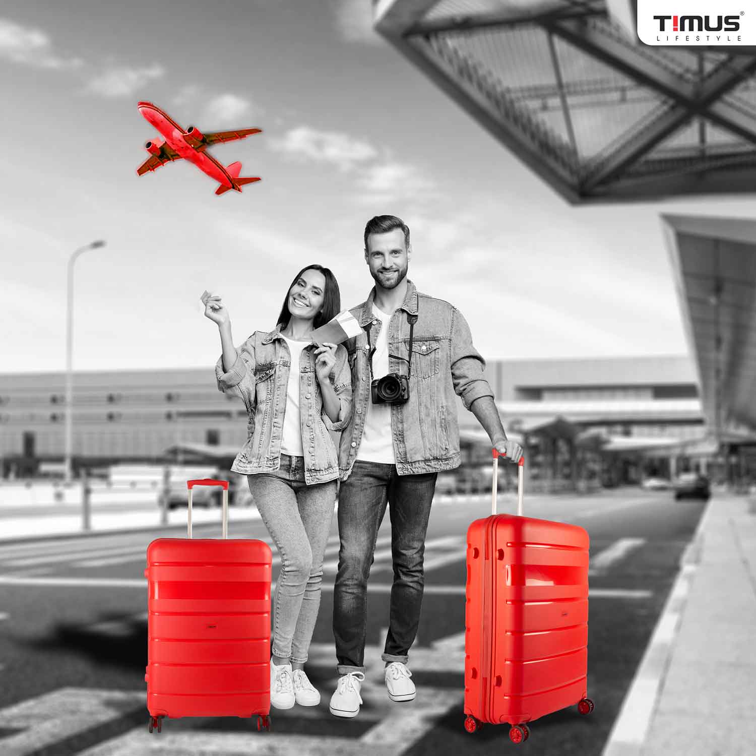 Traveler with Sunlite red trolley at airport, highlighting vibrant color and travel-ready style.