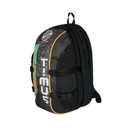 Left front angled view of the Here I Am backpack in black with green, yellow, and orange design accents, showcasing a large vertical TIMUS logo on the front, multiple zippered compartments, buckle straps, and a top carry handle.