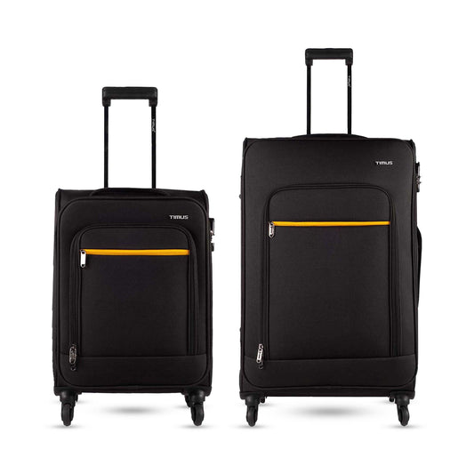Two pieces of Nexon soft luggage, one small and one medium, in black with yellow accents, featuring wheels and a trolley handle.