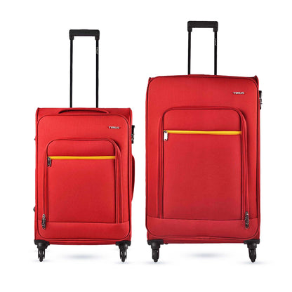 Two pieces of Nexon soft luggage, one medium and one large, in red with yellow accents, featuring wheels and telescopic trolley handle.