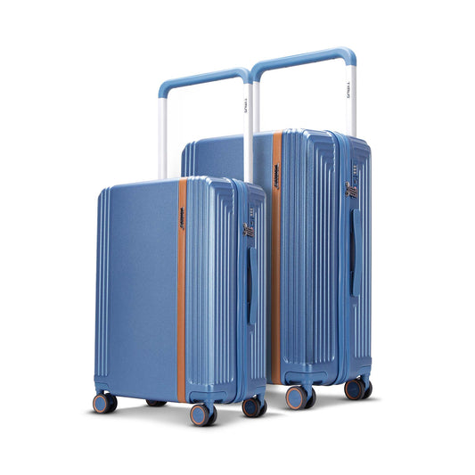 Starlite blue 2-piece luggage set with 68cm medium and 78cm large check-in luggage, both featuring wide trolley handles, leather accent strip, and 360° spinner wheels.