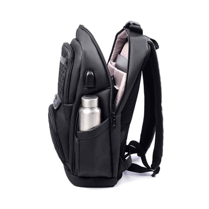 Open side view of black Berlin professional backpack showing padded laptop sleeve, USB port, and water bottle pocket.