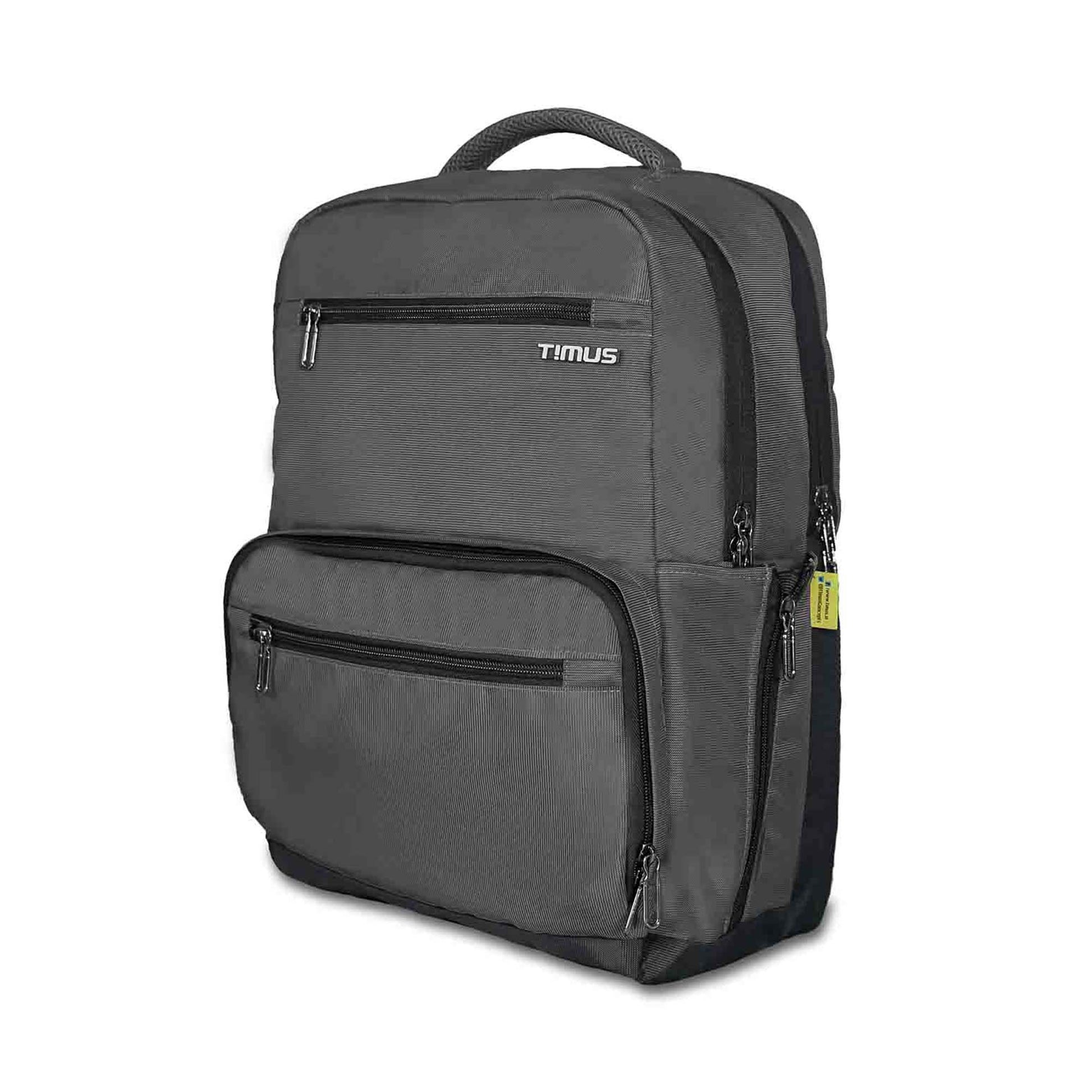 Left front-angled view of grey Timus Canada casual backpack featuring dual zippered compartments, front zip pockets, padded top carry handle, and side mesh pocket with yellow brand tag.