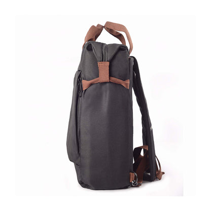 Left side view of black Timus Chicago urban backpack showing front pocket side zipper, brown handles, and shoulder straps.