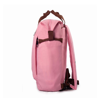 Left side view of pink Timus Chicago urban backpack showing side front pocket zipper, brown handles, and shoulder strap.
