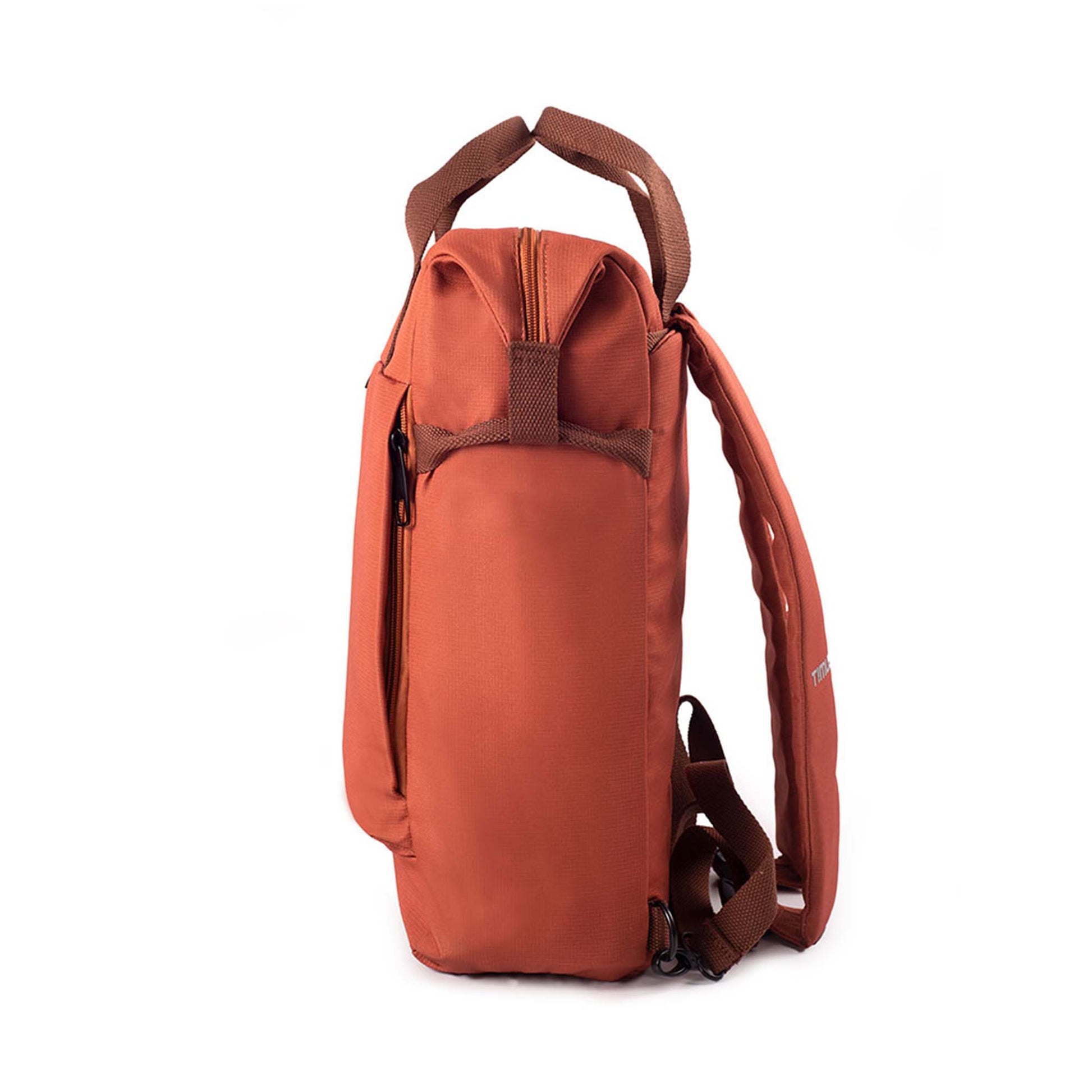 Left side view of rust Timus Chicago urban backpack showing front pocket side zipper, brown handles, and shoulder straps.
