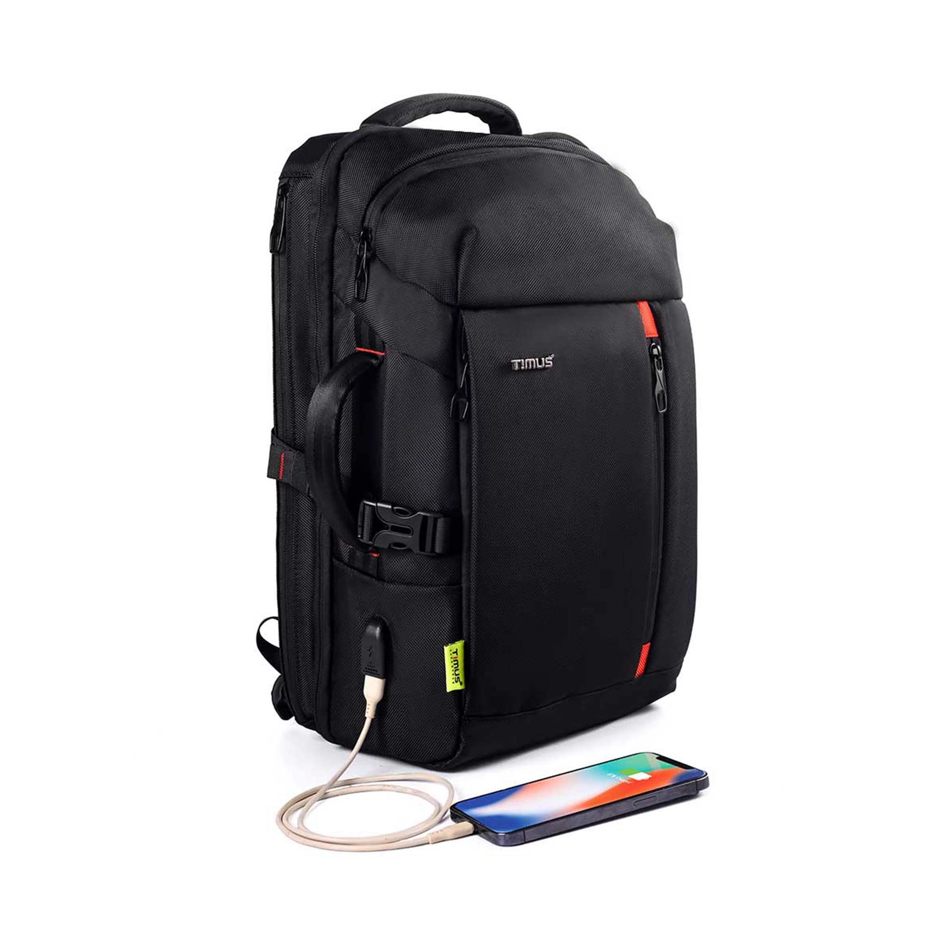 right front angled view of black London laptop backpack by TIMUS showing padded handle, USB charging port with cable connected to a smartphone, multiple zippered compartments, side handle for easy carrying, and red accent details.
