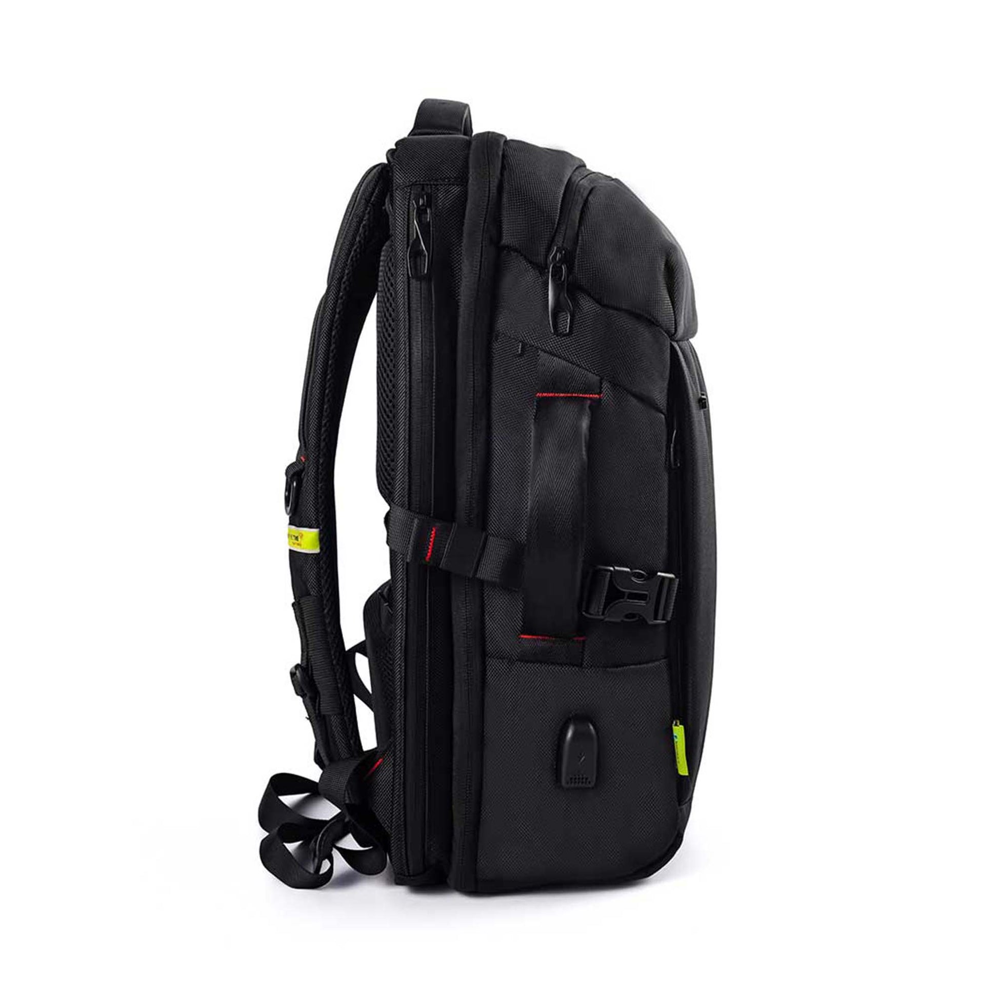 Side view of black London laptop backpack by TIMUS showing padded shoulder straps with adjustable buckles, side handle with buckle clasp, USB charging port, and red accent stitching.
