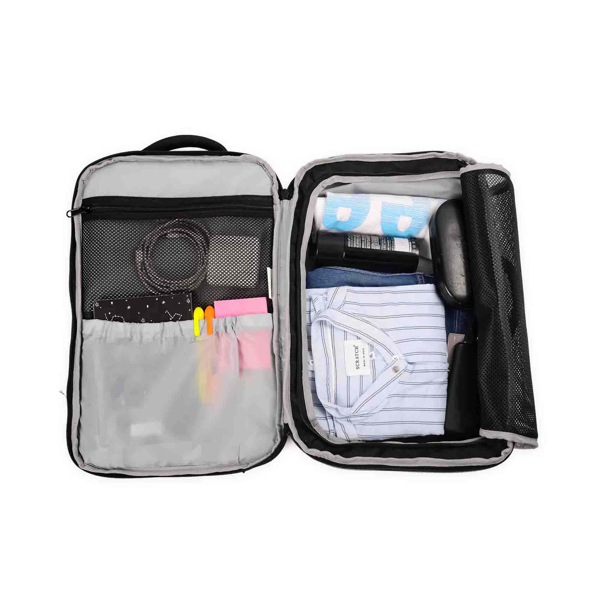 Open view of London laptop backpack showing organized interior with clothes, toiletries, pens, cables, and a notebook in compartments and mesh pockets.