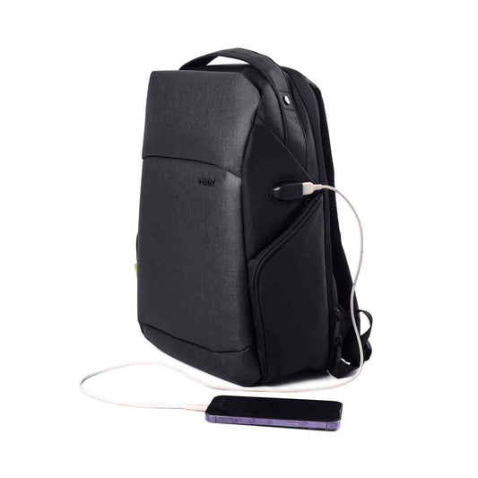 Left front angled view of the black Madrid Laptop Backpack by Timus, featuring a sleek design with a visible USB charging port and a connected smartphone.