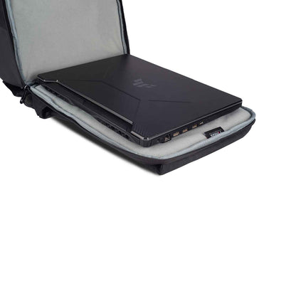 Close-up view of the Timus Magnet Overnighter backpack open flat with a black laptop inside its padded, grey fabric-lined laptop compartment.