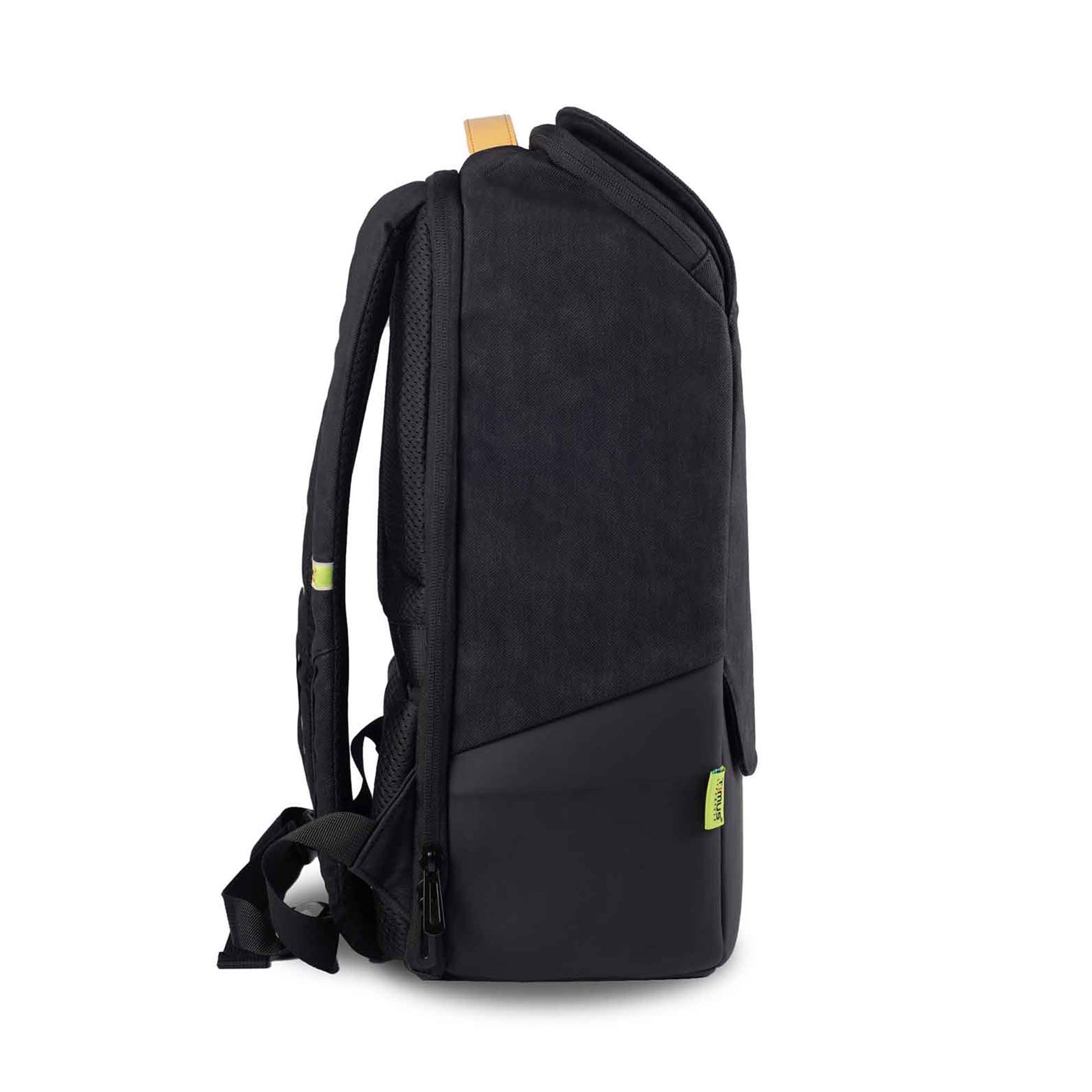Right side view of the Timus Magnet Overnighter backpack in black, showing the slim profile with a black fabric upper section and smooth black lower section. The backpack features a tan leather handle on top and a green Timus tag on the lower right side and shoulder straps.