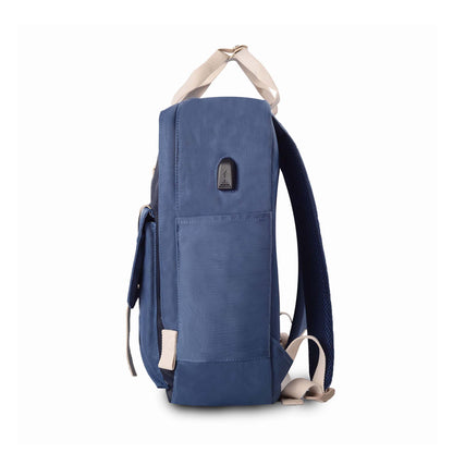Left side view of Timus Miami navy blue urban backpack featuring USB port, top handle, padded shoulder straps and side pocket.

