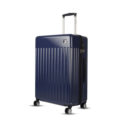 Left side angled view of Timus Neolite navy blue hard shell large check-in luggage with vertical ribbed texture, extended telescopic handle, side handle, TSA lock, and 360° double spinner wheels