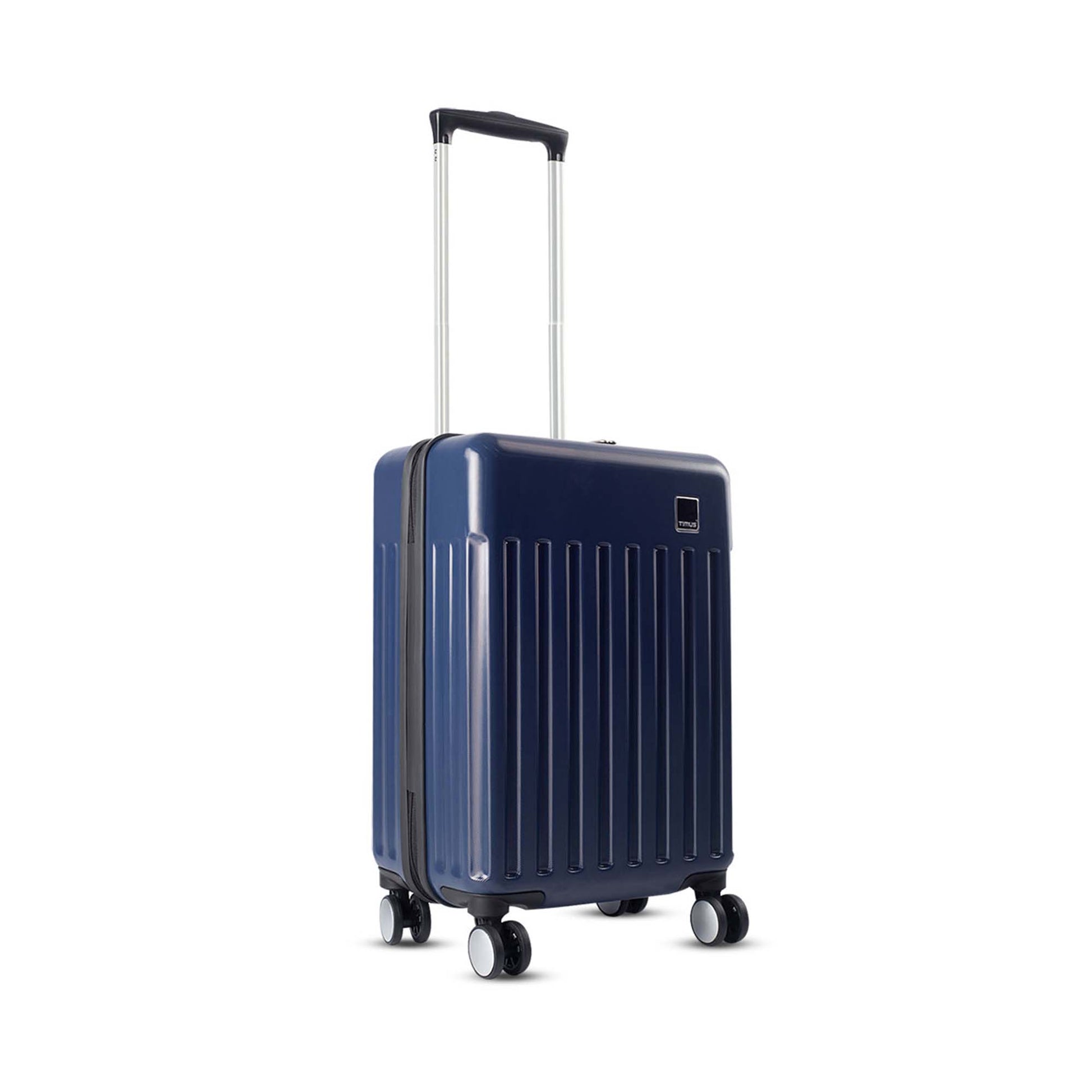 Right side angled view of Timus Neolite navy blue hard shell cabin trolley luggage with vertical ribbed texture, 360-degree double spinner wheels, and extended telescopic handle on a white background