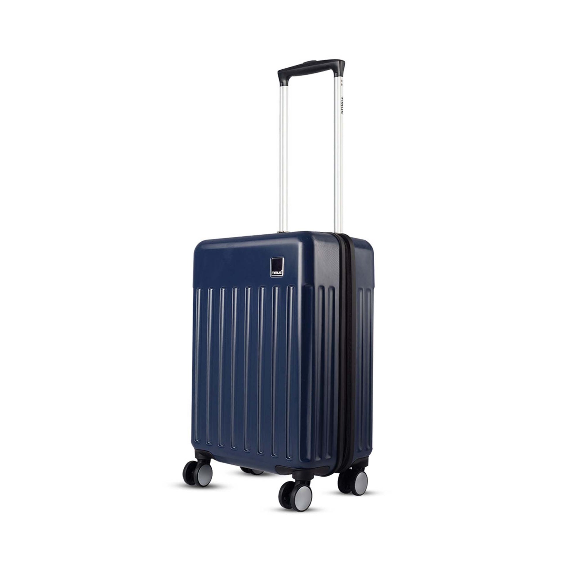 Left side angled view of Timus Neolite navy blue hard cabin trolley luggage featuring 360-degree rotation double spinner wheels, adjustable telescopic handle, and vertical ribbed design on a white background
