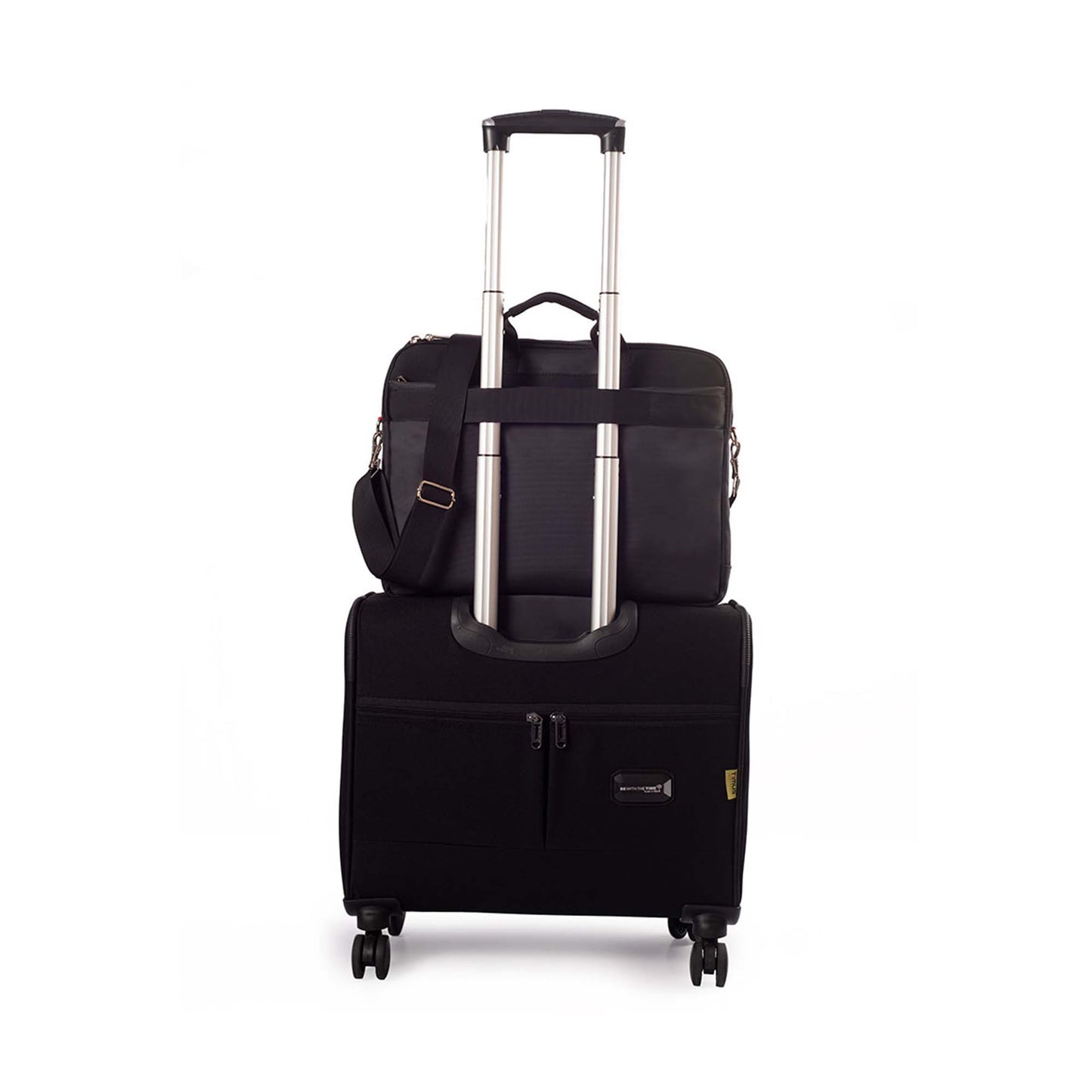 Black Timus New York laptop carry-on bag shown from the back, securely attached to the handle of a black rolling suitcase with dual spinner wheels on a white background.