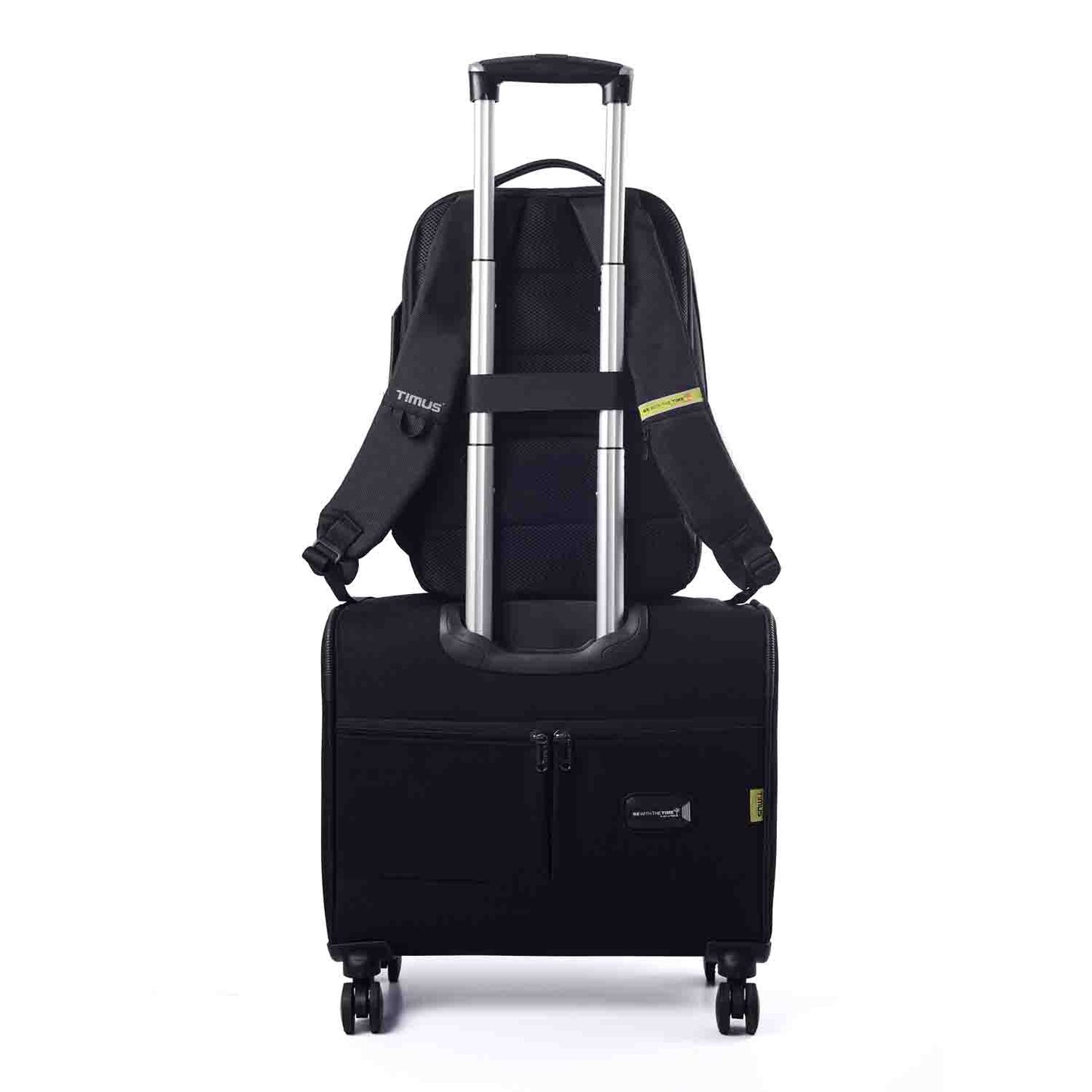 Paris laptop backpack secured on a rolling suitcase using the luggage strap for easy travel.