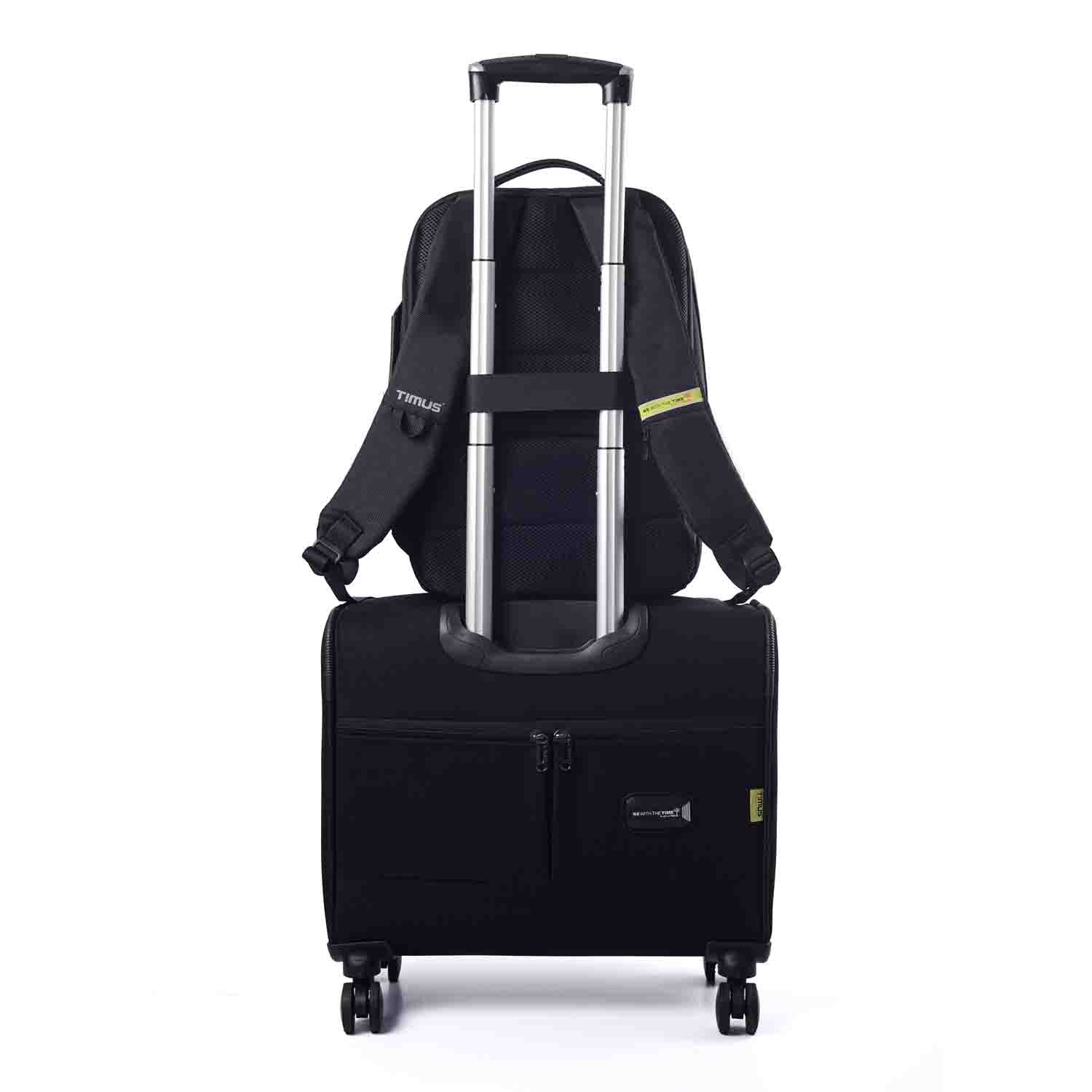 Paris laptop backpack secured on a rolling suitcase using the luggage strap for easy travel.